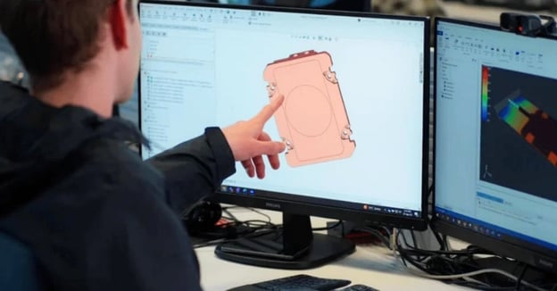 Manufacturing engineer reviews CAD model